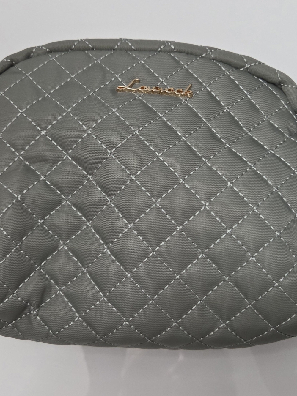 Lavish Quilted Gray Makeup Pouch with Gold Emblem